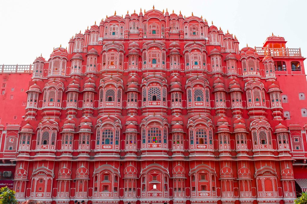 Explore the intricate facade of Hawa Mahal in Jaipur, showcasing its stunning pink architecture and cultural significance.